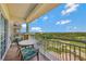 Spacious balcony with golf course view and patio furniture at 7593 Gathering Dr # 505, Reunion, FL 34747