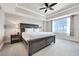 Spacious Primary bedroom with large window and ceiling fan at 7593 Gathering Dr # 505, Reunion, FL 34747