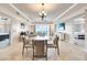 Open living room with sofas, chairs, and a large TV at 7593 Gathering Dr # 505, Reunion, FL 34747