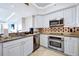 Modern kitchen with stainless steel appliances and granite countertops at 7593 Gathering Dr # 505, Reunion, FL 34747