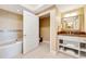 Elegant bathroom with soaking tub, granite vanity, and separate shower at 7593 Gathering Dr # 505, Reunion, FL 34747