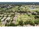 Aerial view showcasing the community's location near a golf course and lake at 7593 Gathering Dr # 505, Reunion, FL 34747