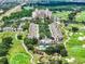 Aerial view of community near golf course and resort at 7593 Gathering Dr # 505, Reunion, FL 34747