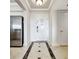 Elegant entryway with tile flooring and access to kitchen at 7593 Gathering Dr # 505, Reunion, FL 34747