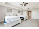 Well-lit bedroom with two twin beds and ceiling fan at 7593 Gathering Dr # 505, Reunion, FL 34747