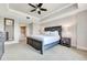 Bright bedroom with ensuite bathroom access and a large bed at 7593 Gathering Dr # 505, Reunion, FL 34747