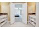 Bathroom with double sinks and a view of bedroom at 7593 Gathering Dr # 505, Reunion, FL 34747