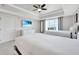Comfortable bedroom with two twin beds, TV, and large windows at 7593 Gathering Dr # 505, Reunion, FL 34747