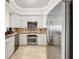 Modern kitchen with stainless steel appliances and granite countertops at 7593 Gathering Dr # 505, Reunion, FL 34747