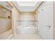 Relaxing bathroom with soaking tub and tile flooring at 7593 Gathering Dr # 505, Reunion, FL 34747