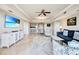 Spacious living room with comfortable seating and large TV at 7593 Gathering Dr # 505, Reunion, FL 34747