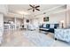 Open concept living space with adjacent kitchen and dining area at 7593 Gathering Dr # 505, Reunion, FL 34747