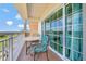 Private balcony with golf course view and seating area at 7593 Gathering Dr # 505, Reunion, FL 34747