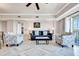 Comfortable living room featuring a stylish sofa and armchairs at 7593 Gathering Dr # 505, Reunion, FL 34747