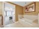 Relaxing bathroom with a soaking tub and bedroom view at 7593 Gathering Dr # 505, Reunion, FL 34747
