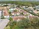 Aerial view of an apartment community with a pool and tennis court at 8827 Grand Palms Cir # B, Kissimmee, FL 34747