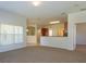 Open living room with neutral decor and access to kitchen at 4107 Vessel Ct, Kissimmee, FL 34746