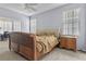 Main bedroom with wooden sleigh bed, nightstand and carpet flooring at 145 Lewis Dr, Davenport, FL 33837