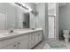 Bathroom boasts double sinks, shower, and updated vanity at 145 Lewis Dr, Davenport, FL 33837