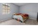 Bright bedroom with carpeted floor and a window at 145 Lewis Dr, Davenport, FL 33837