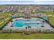 Aerial view of community pool with surrounding lounge chairs at 1353 Hanoverian Dr, Lake Alfred, FL 33850