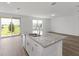 Open concept kitchen with island and stainless steel appliances at 1353 Hanoverian Dr, Lake Alfred, FL 33850