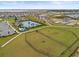 Community dog park with fenced-in area and benches at 1353 Hanoverian Dr, Lake Alfred, FL 33850