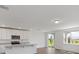 Open concept kitchen with island and stainless steel appliances at 1353 Hanoverian Dr, Lake Alfred, FL 33850