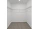 Spacious walk-in closet with wire shelving at 1353 Hanoverian Dr, Lake Alfred, FL 33850