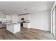 Open concept kitchen with island and stainless steel appliances at 1353 Hanoverian Dr, Lake Alfred, FL 33850