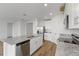 Open concept kitchen with island and stainless steel appliances at 1353 Hanoverian Dr, Lake Alfred, FL 33850