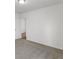 Spacious bedroom with grey carpet and an open door to another room at 1353 Hanoverian Dr, Lake Alfred, FL 33850