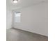 Simple bedroom with grey carpet and a window at 1353 Hanoverian Dr, Lake Alfred, FL 33850