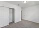 Simple bedroom with gray carpet and a large closet at 1353 Hanoverian Dr, Lake Alfred, FL 33850