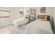 Two twin beds in a well-lit bedroom with playful decor at 6274 Chorus Dr, Mascotte, FL 34753