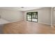 Living room with hardwood floors and patio doors at 336 Saint Dunstan Way, Winter Park, FL 32792