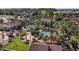 Aerial view of community pool, clubhouse, and lush landscaping at 2909 Calabria Ave, Davenport, FL 33837