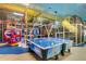 Two air hockey tables and a play area in a game room at 2909 Calabria Ave, Davenport, FL 33837