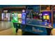 Air hockey table in a brightly lit game room at 2909 Calabria Ave, Davenport, FL 33837