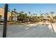 Beach volleyball court with sand and palm trees at 2909 Calabria Ave, Davenport, FL 33837
