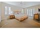 Spacious main bedroom with a king-size bed and sliding doors at 2909 Calabria Ave, Davenport, FL 33837