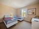 Bedroom with two twin beds, window with shutters, and neutral decor at 2909 Calabria Ave, Davenport, FL 33837