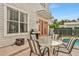 Patio with seating area and grill near pool at 7768 Linkside Loop, Reunion, FL 34747
