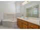 Spa-like bathroom with soaking tub and walk-in shower at 7768 Linkside Loop, Reunion, FL 34747