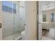 Bathroom with walk-in shower and toilet at 7768 Linkside Loop, Reunion, FL 34747
