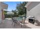 Outdoor patio with pool, seating area, and grill at 7768 Linkside Loop, Reunion, FL 34747