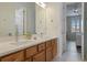 Double vanity bathroom with modern finishes at 7768 Linkside Loop, Reunion, FL 34747