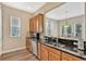 Well-equipped kitchen with granite countertops and wood cabinets at 7768 Linkside Loop, Reunion, FL 34747