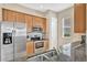Stainless steel appliances and dark brown granite countertops at 7768 Linkside Loop, Reunion, FL 34747