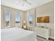 Main bedroom with lake view at 7768 Linkside Loop, Reunion, FL 34747